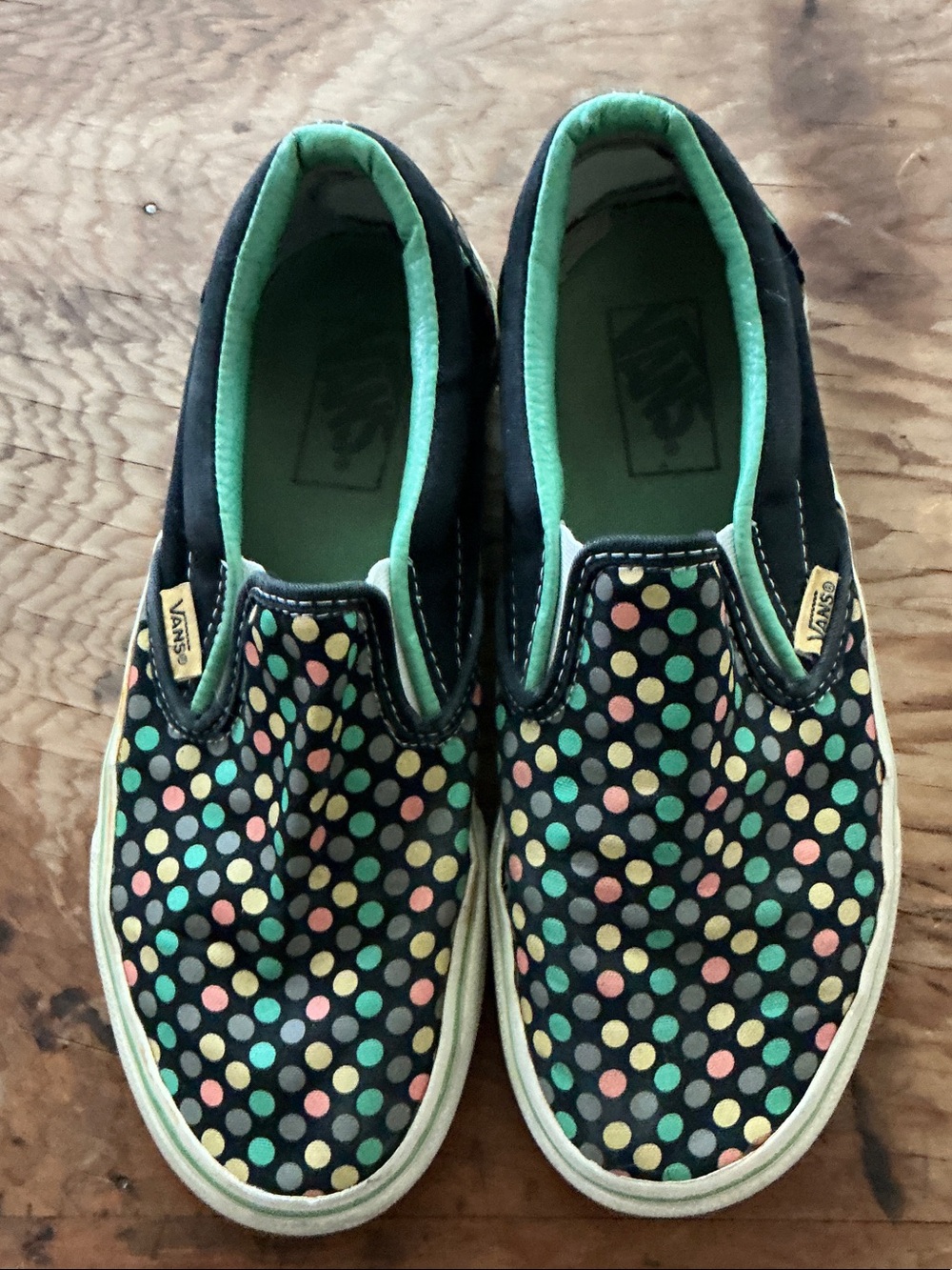 Vans Women's Slip-On Sneakers in Black with Multicolor Polka Dots